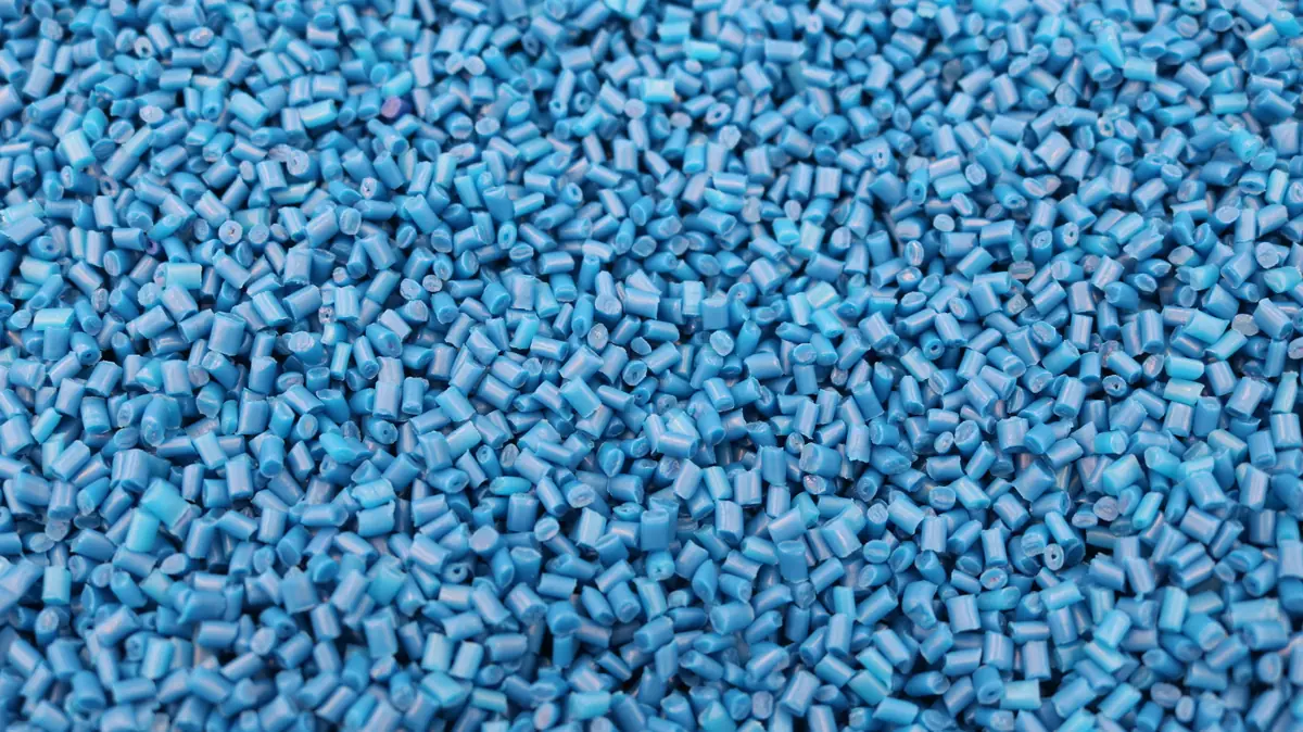 Blue plastic granules used as raw material for injection molding